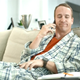 Peyton Manning grimaces at his pencil-and-paper day planner. (Screenshot: DirecTV)